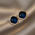 Blue Square Gem Look Stud Earrings with Gold Tone Frames view 1