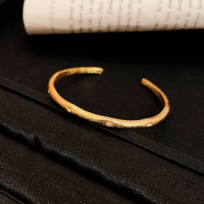 Hammered Gold Tone Open Cuff Bracelets with Crystal Motifs