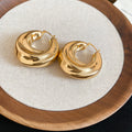 Sculptural Folded Metal Huggie Earrings in Silver and Gold Tone view 7