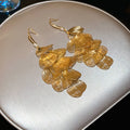 Layered Metal Petal Hook Earrings In Gold And Silver view 6