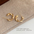 Gold Polished Twisted Ribbon Open Hoop Stud Earrings view 4