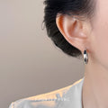 Silver Tone Small Oval Hoop Earrings With Lever Back Closure view 2