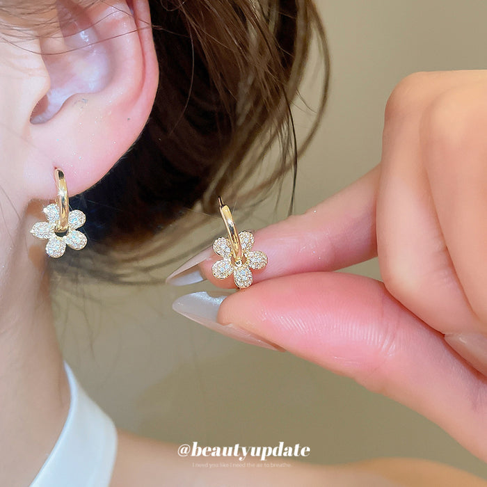 Gold Tone Flower Huggie Earrings with Crystal Petals