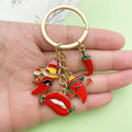 Gold-Tone Keychain with Four Red Chili Pepper and Lips Charms view 2