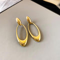 Open Oval Sculptural Drop Earrings In Gold And Silver Tone view 6