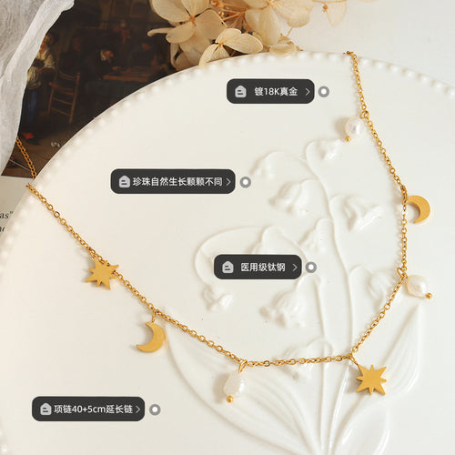 Gold star moon pearl necklace on white plate with material size labels