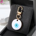 Gold Tone Oversized Round Evil Eye Clip Keychains in Two Colors view 4