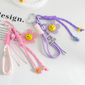 Woven Paracord Flower Keychain with Acrylic Smiley Charm view 1