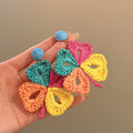 Woven Petal Flower Stud Earrings With Polished Metal Tone Details view 2