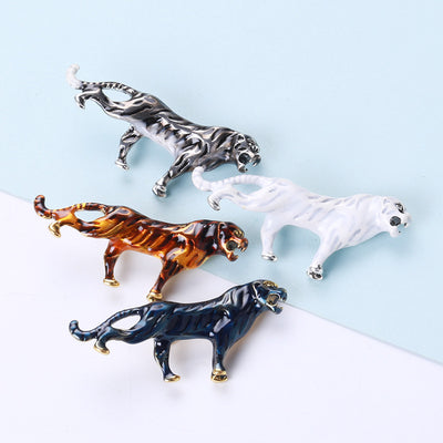 Front view of the striped enamel tiger brooch showing a long striped walking tiger in glossy enamel