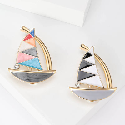 Front product view of the enamel sailboat brooch on a light background