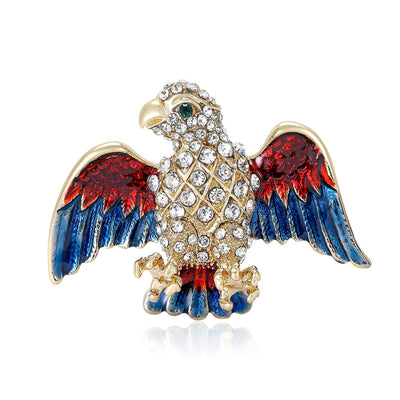 Front view of a crystal-covered eagle with colorful enamel wings