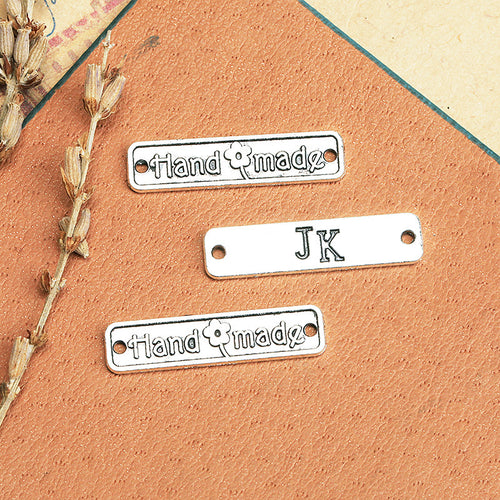 Connector bars with Handmade and JK lettering