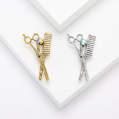 Front view of the scissors comb rhinestone brooch