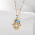 Gold Tone Blue Opal Effect Evil Eye and Hamsa Pendant Necklaces view 2
