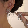 Silver Tone Crystal Floral Drop Earrings with Pearl Accents view 1