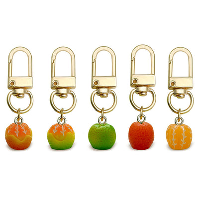 Image 1 showing a set of four fruit shaped key chains.