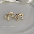 Minimal Wire Bow Stud Earrings Gold and Silver Tones view 4