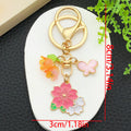 Blossom Bee Butterfly Shell and Bell Flower Keychains view 5