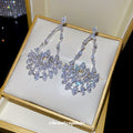 Silver Openwork Crystal Teardrop Stud Earrings with Polished Metal Details view 4