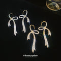 Crystal Bow Hook Earrings in Gold Tone or Silver Tone view 4