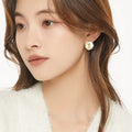 Gold Round Rose Stud Earrings White Inlay Wavy Frame view 1