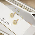 Clear Teardrop Gold Filigree Flower Small Hook Earrings view 4