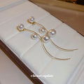Curved Gold Tone Wire Earrings With Pearl Beads With Polished Metal Tone Details view 4