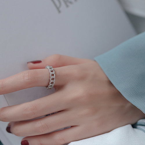 gold-tone chain-link open ring with a clear crystal row shown worn in a styled second view