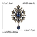 Teardrop Glass Brooch With Ornate Antique Tone Crystal Frame view 10