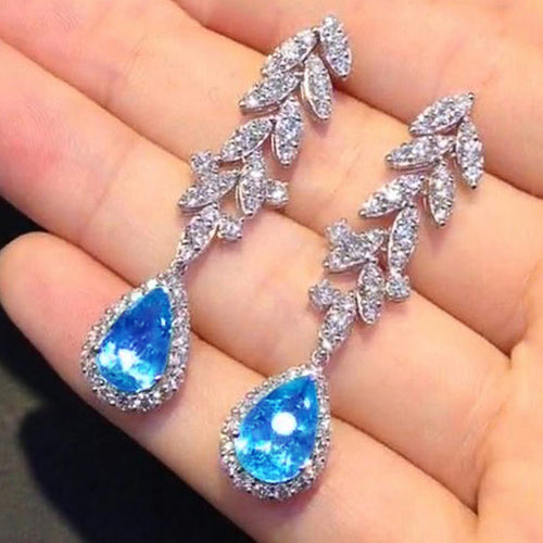 Blue Teardrop and Leaf Cluster Long Drop Earrings in Silver Tone shown in alternate angle
