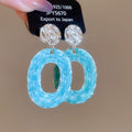 Textured Open Oval Resin Drop Earrings in White and Blue view 7