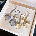 Round Cabochon Drop Earrings with Floral Metal Details view 1