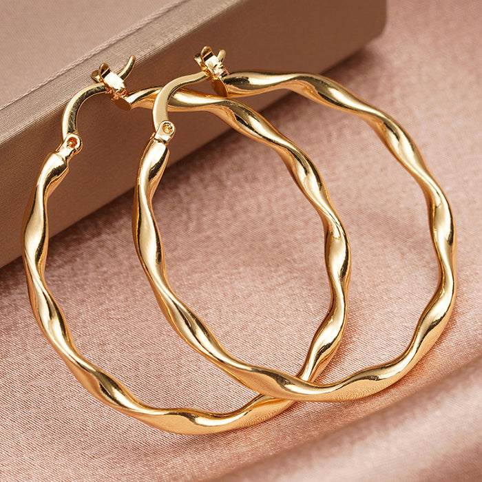 Gold Tone Twisted Wavy Thin Hoop Latch Back Earrings