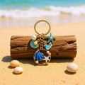 Blue and Pink Shell Dolphin Mermaid and Starfish Keychains view 3