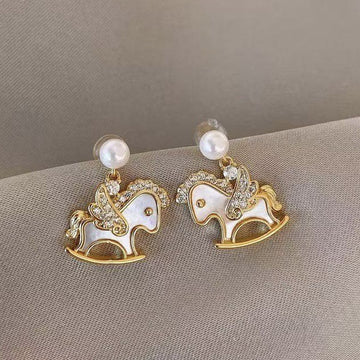 Rocking Horse Pearl Stud Earrings In Gold And Silver
