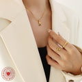 Gold Hand Holding Green Zircon Pendant Ball Chain Necklace view 4