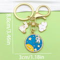 Gold-Tone Space Metal Keychains with Astronaut and Rocket Charms view 8