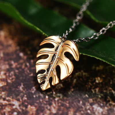 Two Colors monstera leaf necklace shown in front detail view