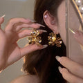 Sculpted Metal Flower Cluster Earrings in Gold and Silver view 2
