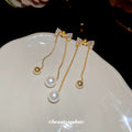 Crystal Bow and Pearl Drop Earrings with Polished Metal Details view 2
