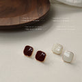 Gold Tone Rounded Square Stud Earrings In White And Burgundy view 1