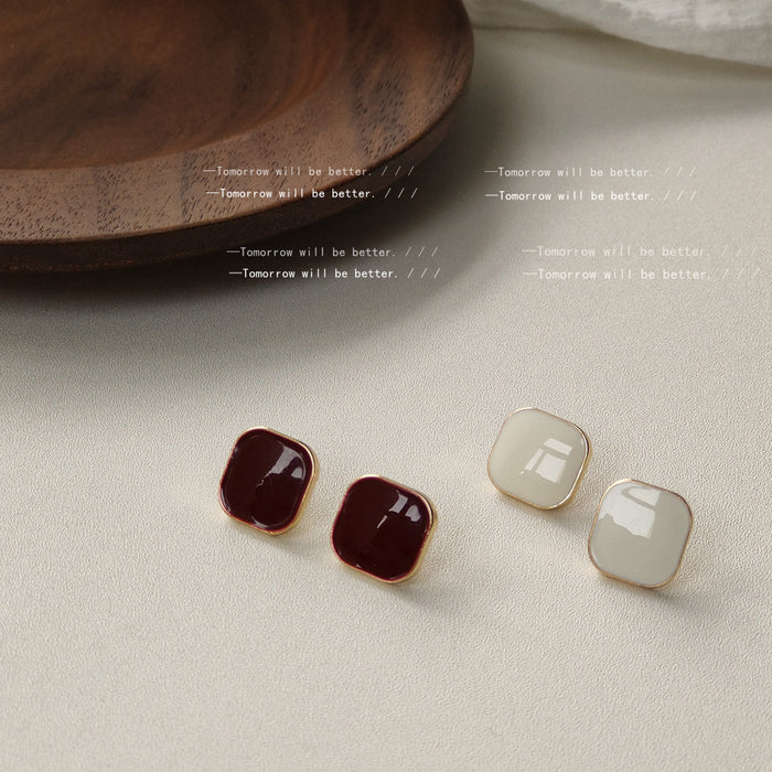 Gold Tone Rounded Square Stud Earrings In White And Burgundy