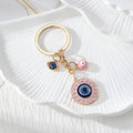 Gold Tone Round Rhinestone Evil Eye Keychains in Four Colors view 2