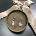 Silver Teardrop Halo Dangle Earrings In A Polished Decorative Design view 2