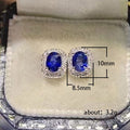 Royal Blue Oval Halo Stud Earrings Clear Stone Border view 5