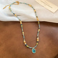 Turquoise Bead Oval Pendant Necklace and Disc Bracelet view 1