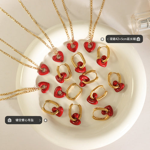 Group of red heart necklaces and hoops with length label