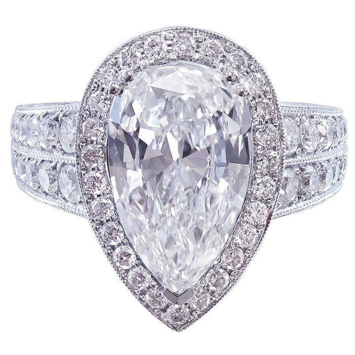 Pear Shaped White Stone Ring with Halo and Pavé Band