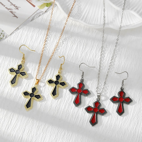 Black gold-tone and red silver-tone enamel cross earrings and necklaces